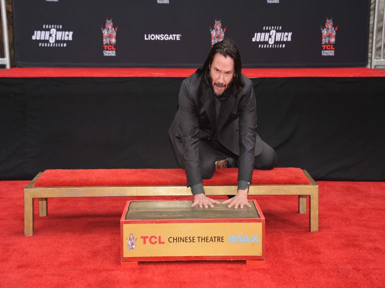 Keanu Reeves leaves his handprints in the Forecourt of the Stars at TCL Chinese Theatre IMAX